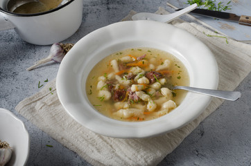 Smoked meat soup with pasta inside