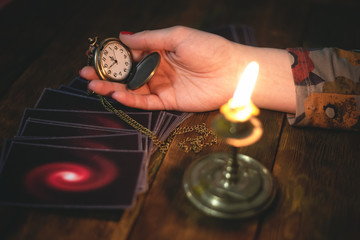 Tarot cards and a woman fortune teller. Future reading concept. Divination.