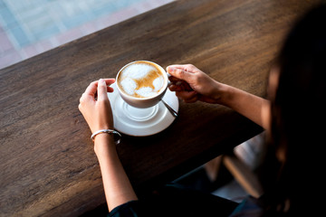Girl having coffee in the bar
