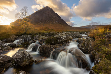 Buachaille Etive Mor Waterfall At Sunset In The Scottish Highlands.