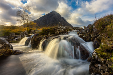 Picturesque Waterfall Etive Mor At Glencoe With Golden Evening Light.
