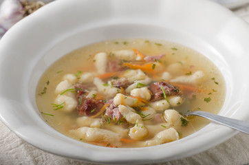 Smoked meat soup with pasta inside