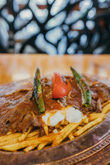 Turkish Doner Kebab, Shawarma or Gyros. Traditional Turkish Doner Kebab meat, iskender, shawarma or gyros in restaurant