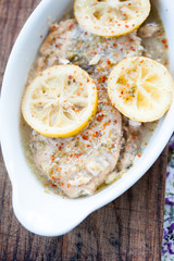 Baked fish fillet in butter and lemon sauce