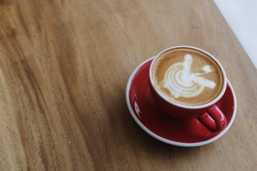 cup of coffee on wooden table