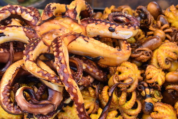 Fresh grilled squid on the chatuchak local market in Bangkok, Thailand