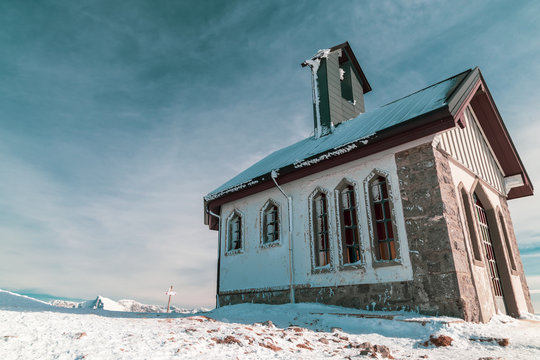The little chapel on the summit of Matajur in a cold winter day