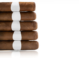 several Cuban cigars lie on an isolated background on the side of the frame. Mockup on the label