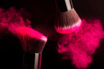 Cosmetics brush and colorful makeup powder