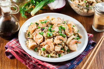 Fried rice with shrimp and vegetables served on a plate