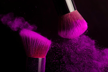 Cosmetics brush and colorful makeup powder