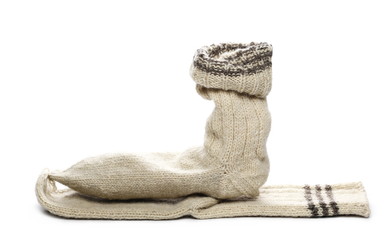 Traditional knitted woolen socks on white background