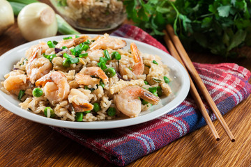 Fried rice with shrimp and vegetables served on a plate