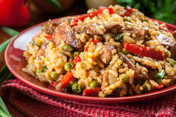 Fried rice with chicken and vegetables served on a plate