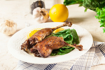 Duck legs confit with orange and salad