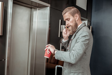 Fototapeta premium Serious blonde male person talking per telephone