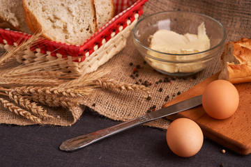 freshly baked bread on dark wooden kitchen table. Selective focus