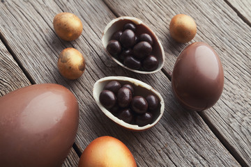 Chocolate easter eggs on wooden background