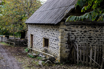Beautiful landscape village house with trees at the forest during autumn, Azerbaijan