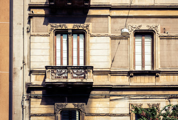 Balcony of old baroque building in Catania, traditional architecture of Sicily, Italy.