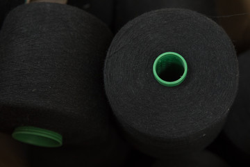 Yarn threads spools of thread bobbin tubes. Textile background concept image