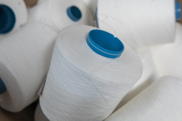 Yarn threads spools of thread bobbin tubes. Textile background concept image