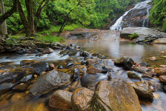 River flowing over rocks and the Debengeni Waterfall