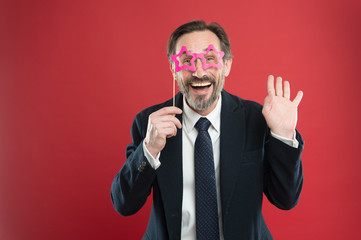 Perfect for corporate party. Handsome mature man wear fake glasses accessories. Funny businessman in party photobooth props. Elderly man enjoying party time. Photo booth party celebration
