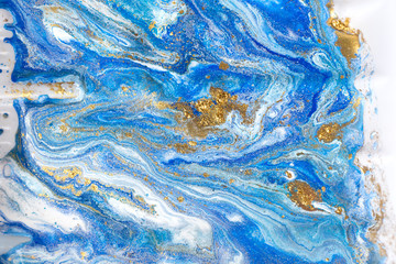 Blue and gold marbling pattern. Golden marble liquid texture.