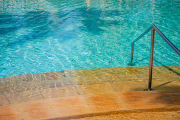 Swimming pool with stair at hotel.