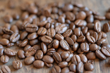 close up of coffee beans on wood table