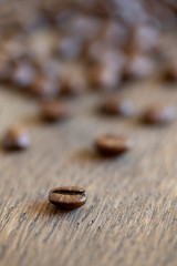 close up of coffee beans on wood table