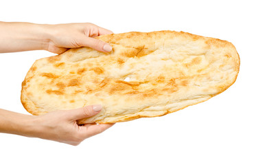 Hand with golden Pitta bread, eastern food culture