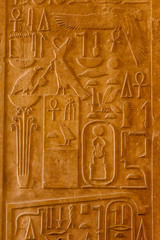 Egyptian ancient hieroglyphs on the stone wall