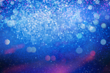 Glitter abstract background. Blue and Pink bokeh lights defocused.