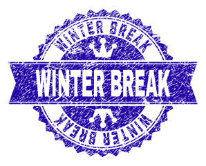 WINTER BREAK rosette stamp seal watermark with grunge texture. Designed with round rosette, ribbon and small crowns. Blue vector rubber print of WINTER BREAK caption with grunge style.