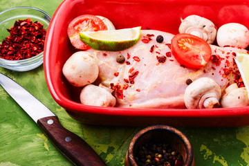 Raw chicken in baking dish