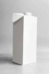 White packaging pack standing on light gray background, front view. Package branding moc-up. Empty template box milk or juice