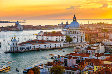 Fototapeta na wymiar Aerial sunset view of Venice, Grand Canal and Basilica di Santa Maria della Salute in Venice, Italy. Architecture and landmarks of Venice. Venice postcard