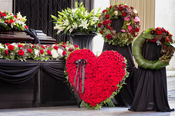 Funeral, beautifully decorated with flower arrangements coffin, close-up