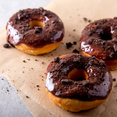 Pastries concept. Donuts with chocolate glaze and chocolate cookies