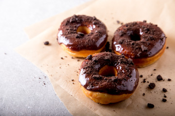 Pastries concept. Donuts with chocolate glaze and chocolate cookies