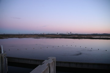 Obraz premium Sunset is reflecting over the water of the Rottemeren and river Rotte at Zevenhuizen close to Rotterdam in the Netherlands