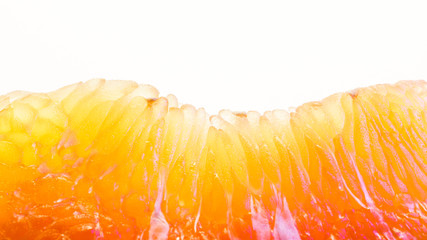 Pomelo fruit macro photography. Peeled pomelo slice on a white background. Carpels with Juicy Vesicles
