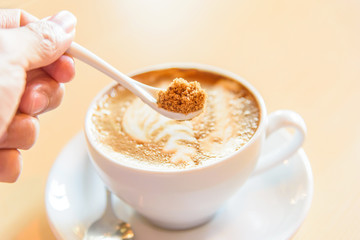 Add sugar to hot coffee