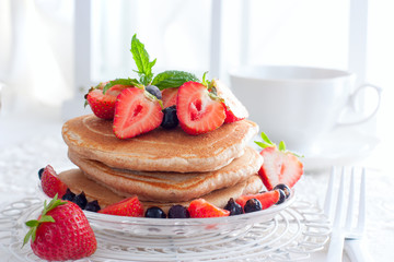 Whole-grain pancakes with fresh strawberries, horizontal