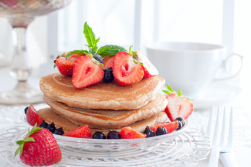 Whole-grain pancakes with fresh strawberries, horizontal