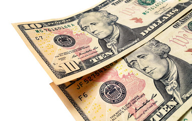 Banknotes of ten american dollars on white background