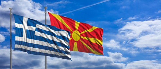 Greece and North Macedonia waving flags on blue sky background. 3d illustration