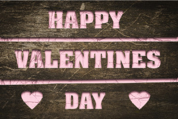 Happy Valentine's Day inscription, cut in boards on pink background. Valentine's day background.